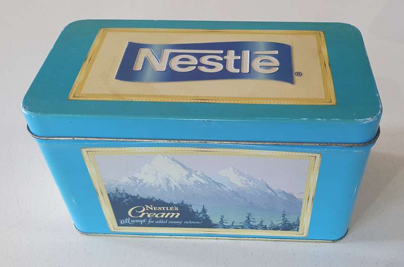 NESTLE tin as per photo