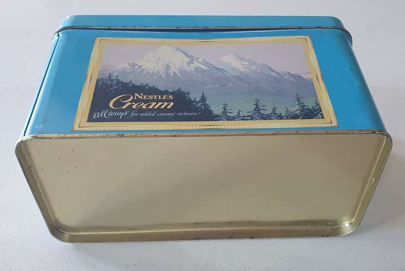 NESTLE tin as per photo