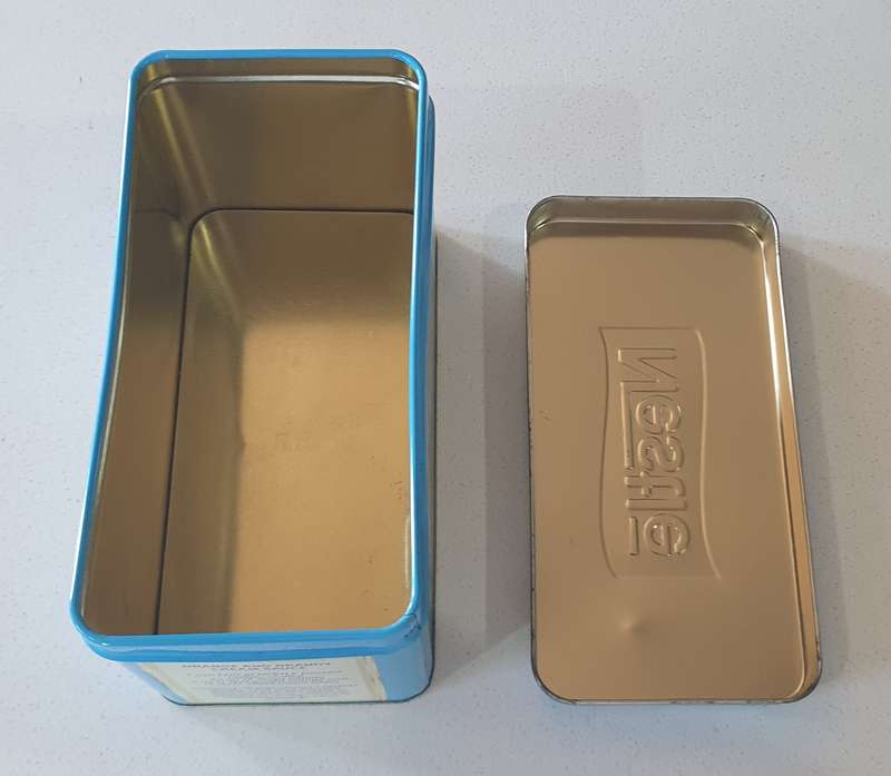 NESTLE tin as per photo