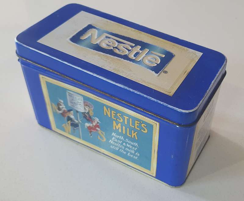 NESTLE tin as per photo