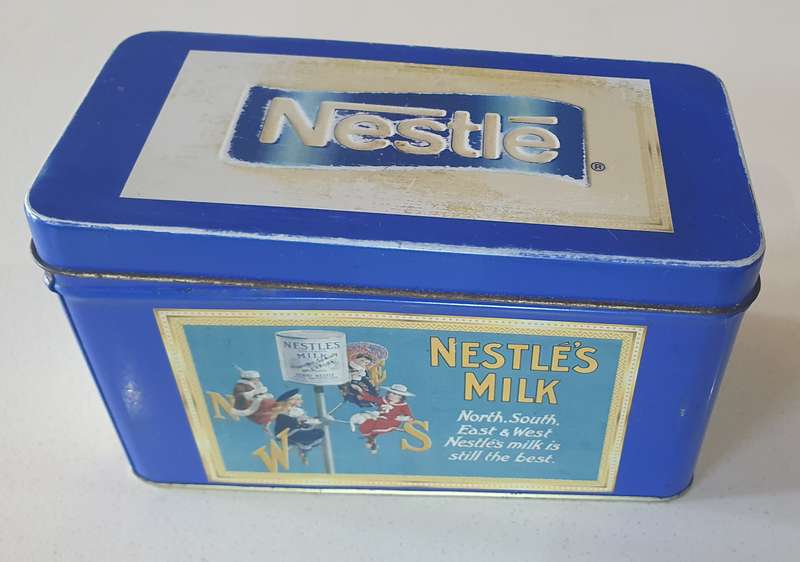 NESTLE tin as per photo