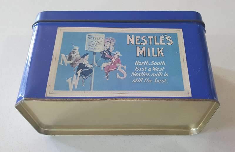 NESTLE tin as per photo