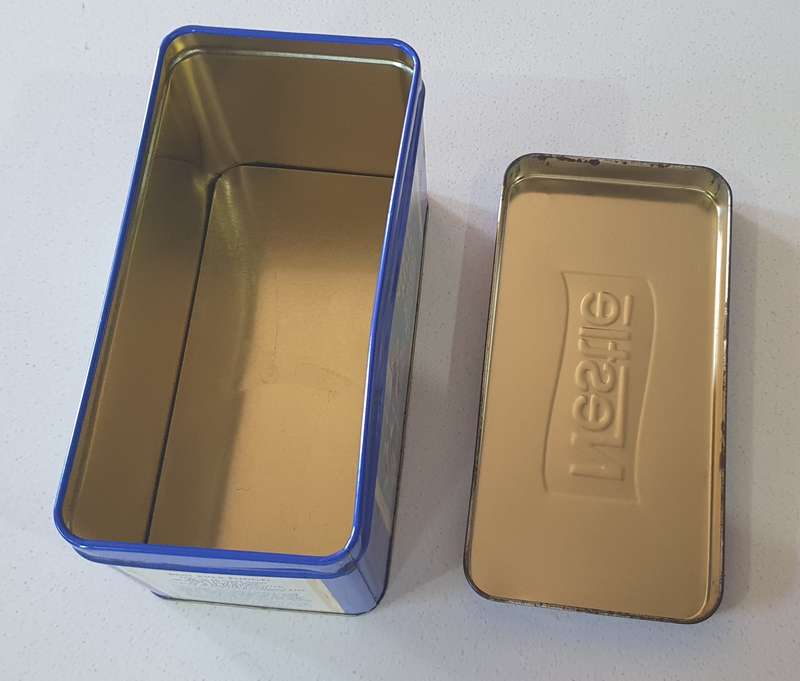 NESTLE tin as per photo