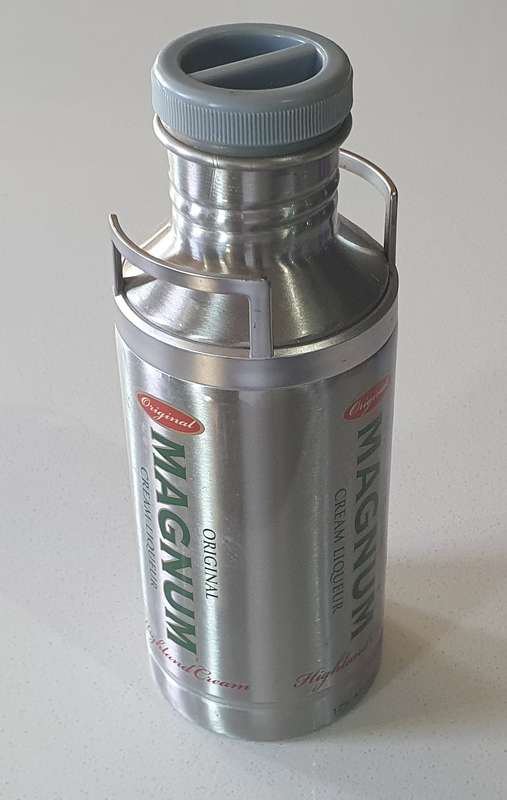 MAGNUM LIQUEUR tin as per photos