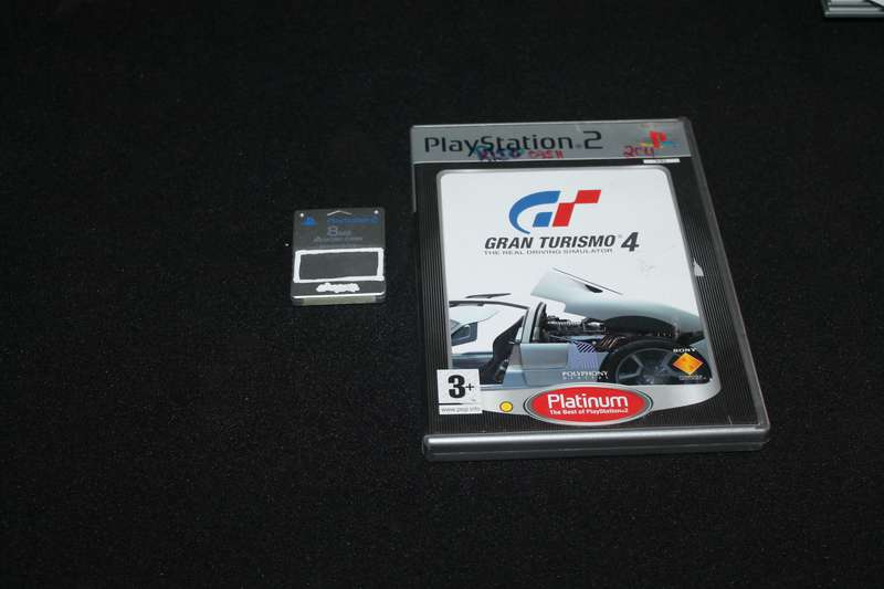 PlayStation 2 Slim with Remote, Game Cables and memory card