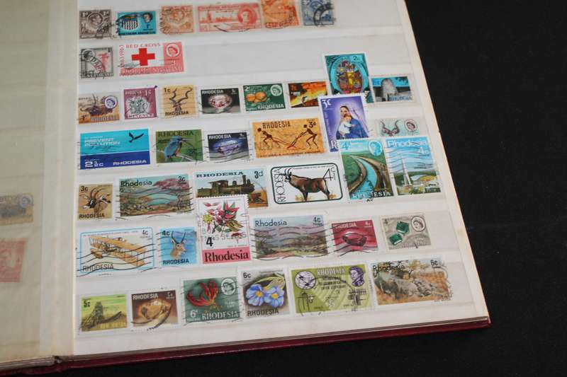 Album with Assorted Stamps Over 400 stamps
