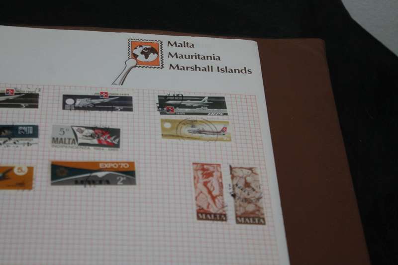 Stamp Album with 300 assorted stamps