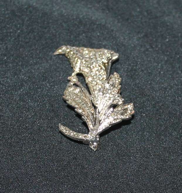 4 Marcasite Brooches and a pair of earrings