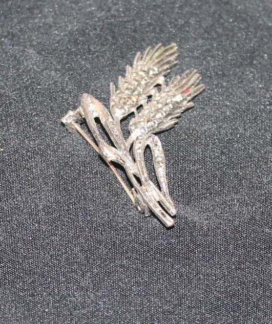 4 Marcasite Brooches and a pair of earrings