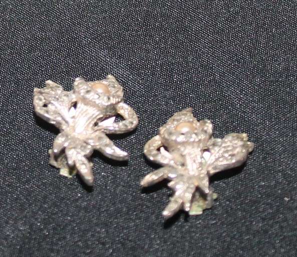4 Marcasite Brooches and a pair of earrings