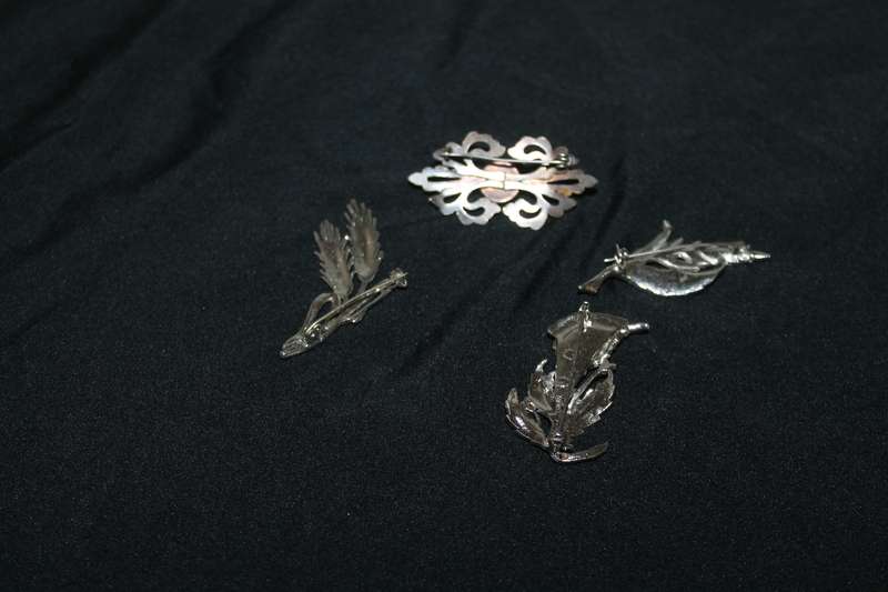 4 Marcasite Brooches and a pair of earrings