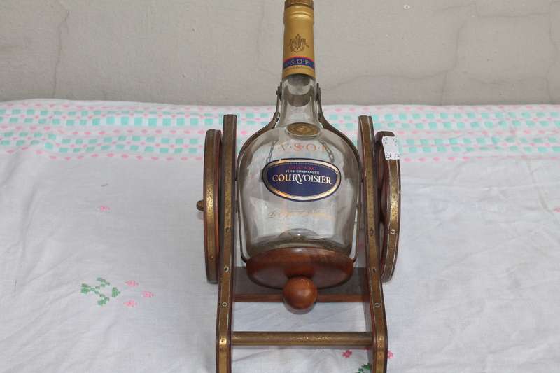 Wagon Holding Brandy bottle