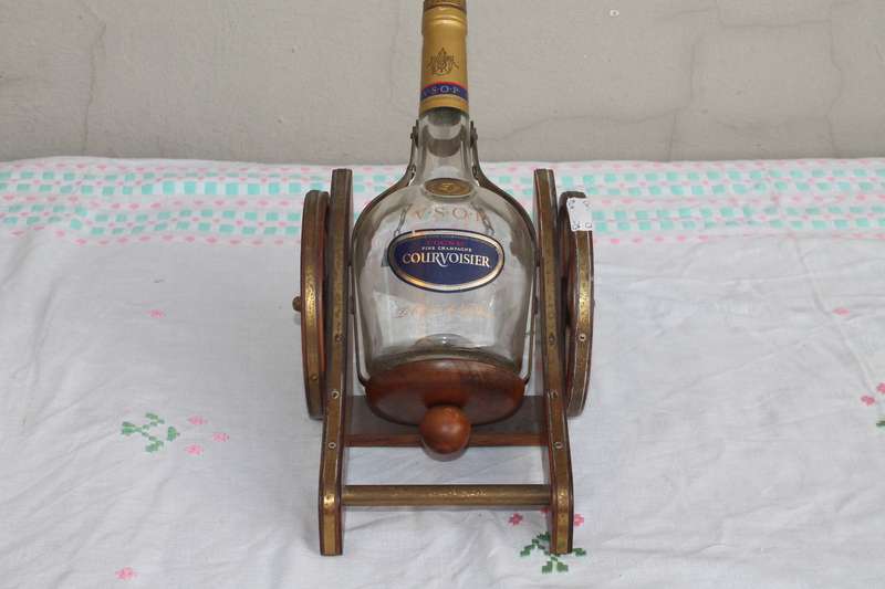 Wagon Holding Brandy bottle