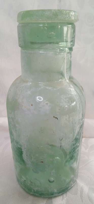 Lovely aqua Mellin's infant food London bottle with original glass lid c1910