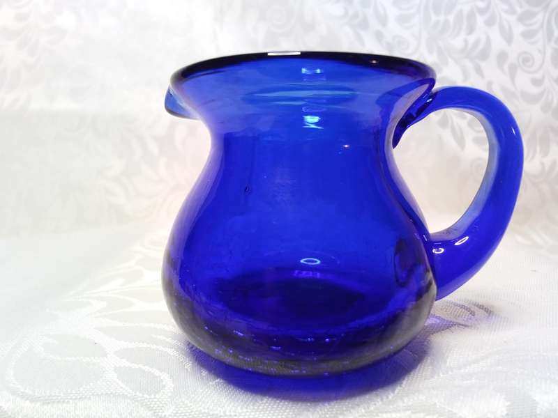 The tiniest vintage cobalt blue jug with crackle glass base
