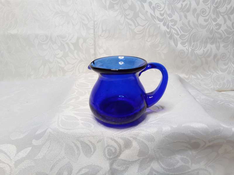 The tiniest vintage cobalt blue jug with crackle glass base
