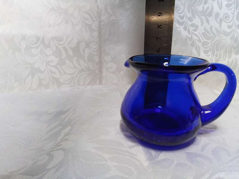 The tiniest vintage cobalt blue jug with crackle glass base