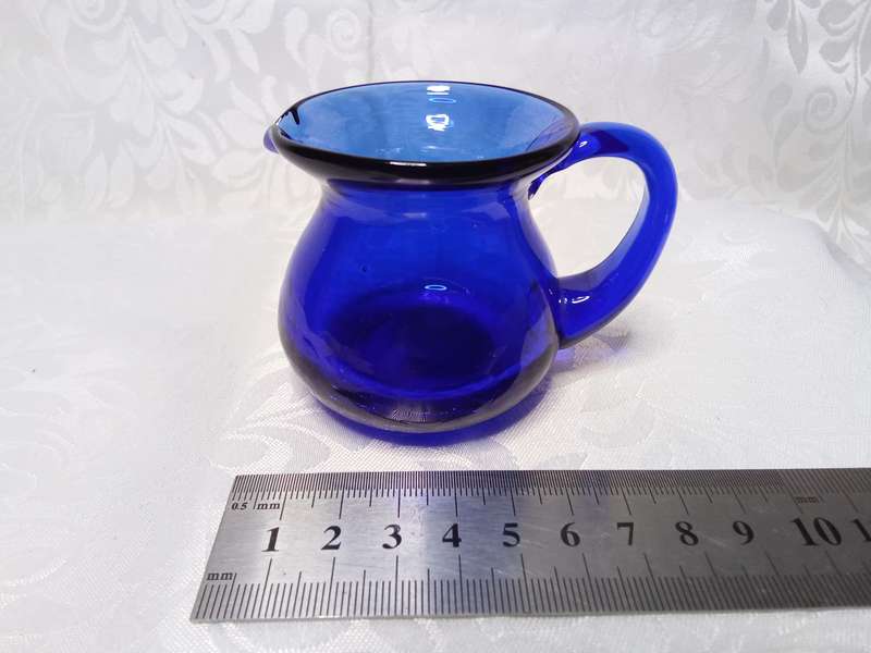 The tiniest vintage cobalt blue jug with crackle glass base