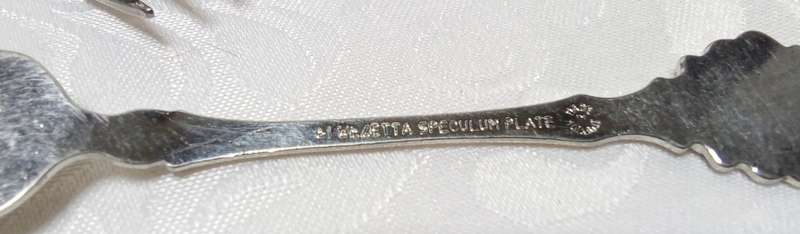 Six vintage "speculum plate" teaspoons with windmill detail