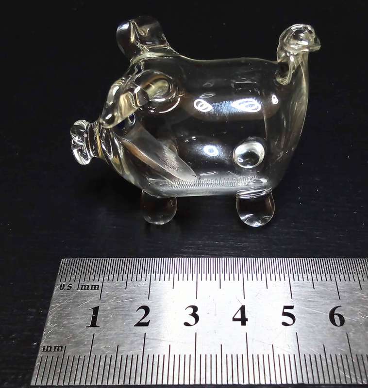 Cutest little vintage glass pig with an "old-fashioned" 10c coin inside