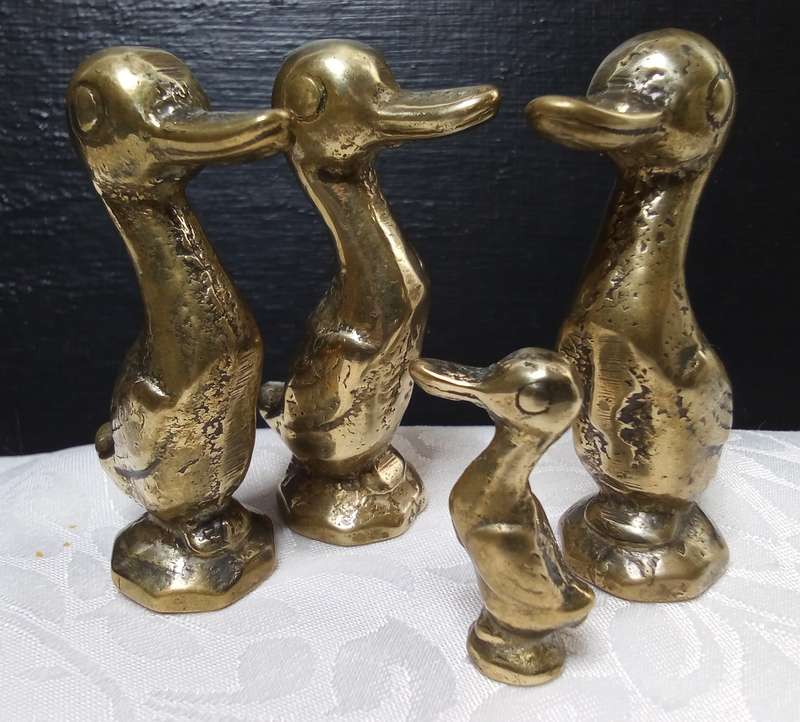 Cute family of vintage brass ducks
