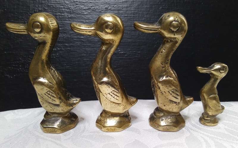 Cute family of vintage brass ducks