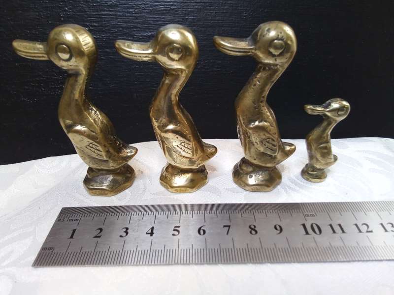 Cute family of vintage brass ducks