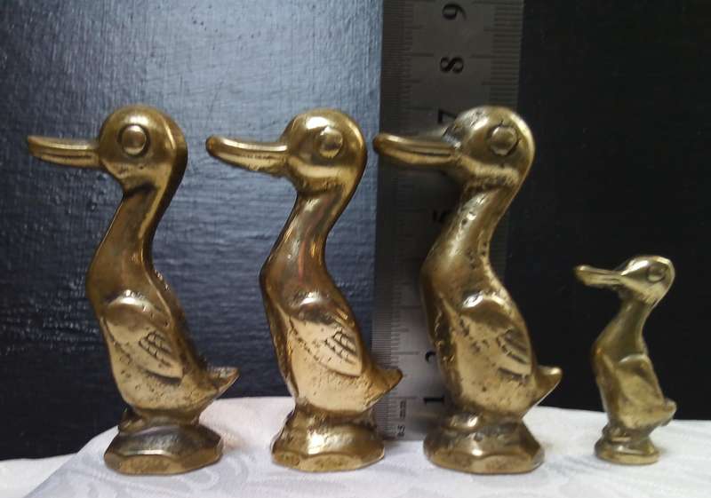 Cute family of vintage brass ducks