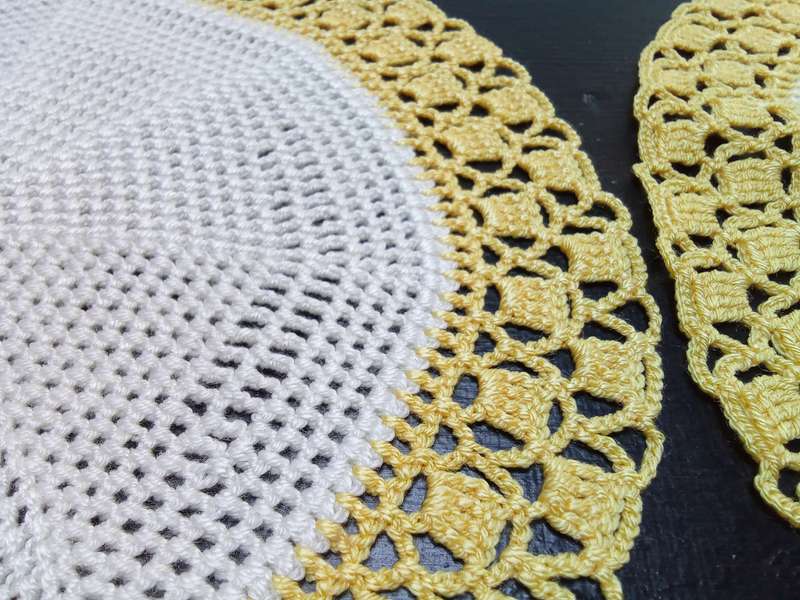 Two charming hand crocheted doilies