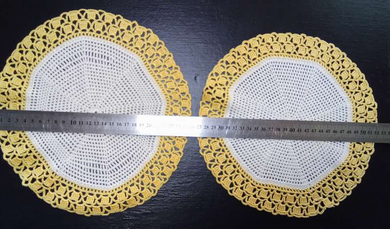 Two charming hand crocheted doilies