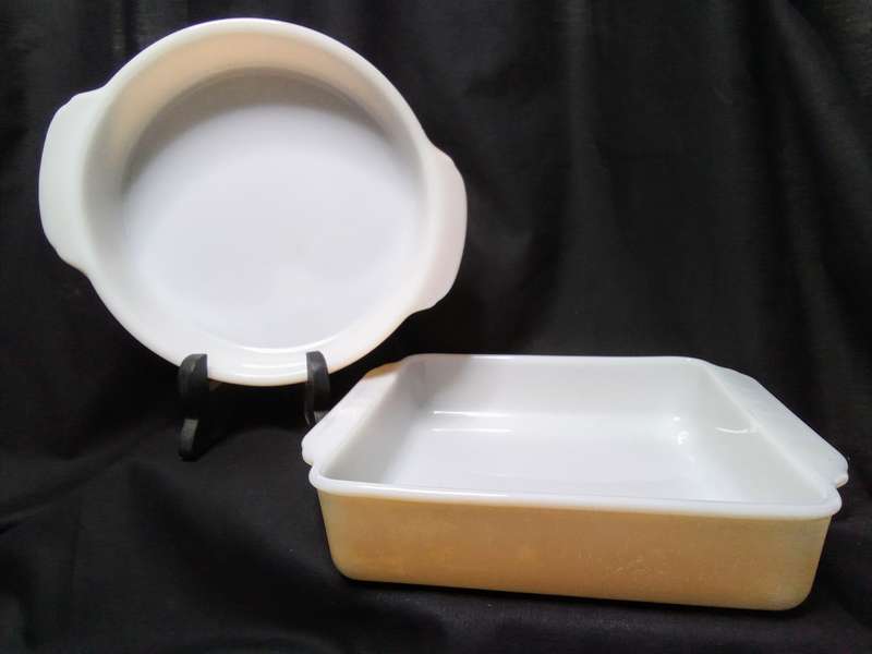 Two charming Anchor Hocking Fire King peach luster casserole dishes