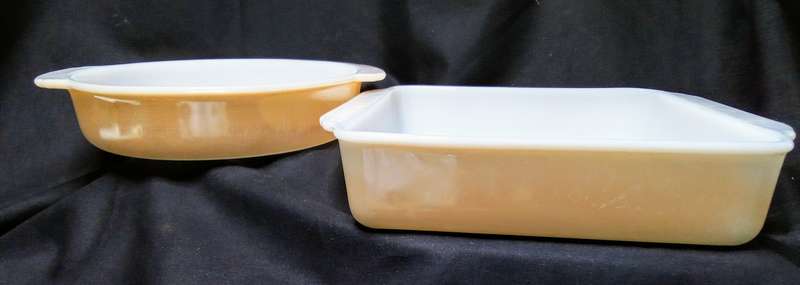 Two charming Anchor Hocking Fire King peach luster casserole dishes