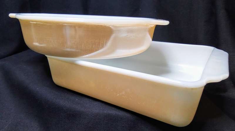 Two charming Anchor Hocking Fire King peach luster casserole dishes
