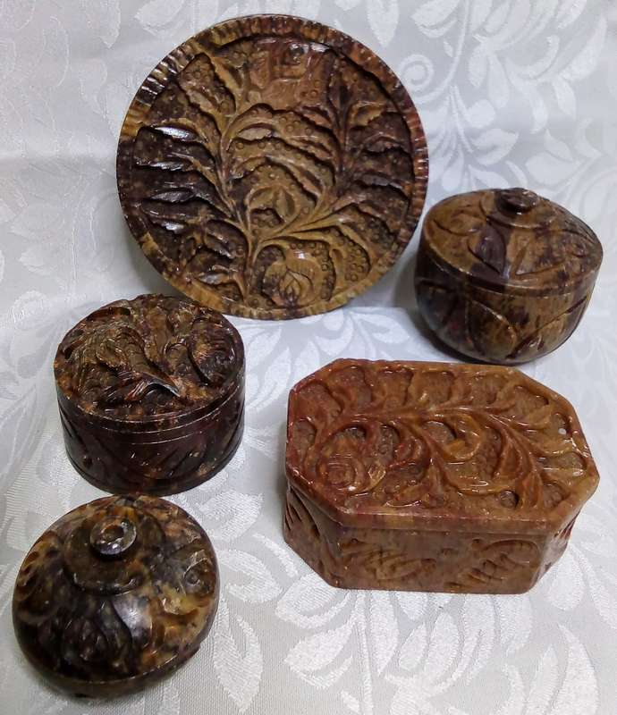 A lovely collection of vintage brown hand carved Soapstone trinket boxes