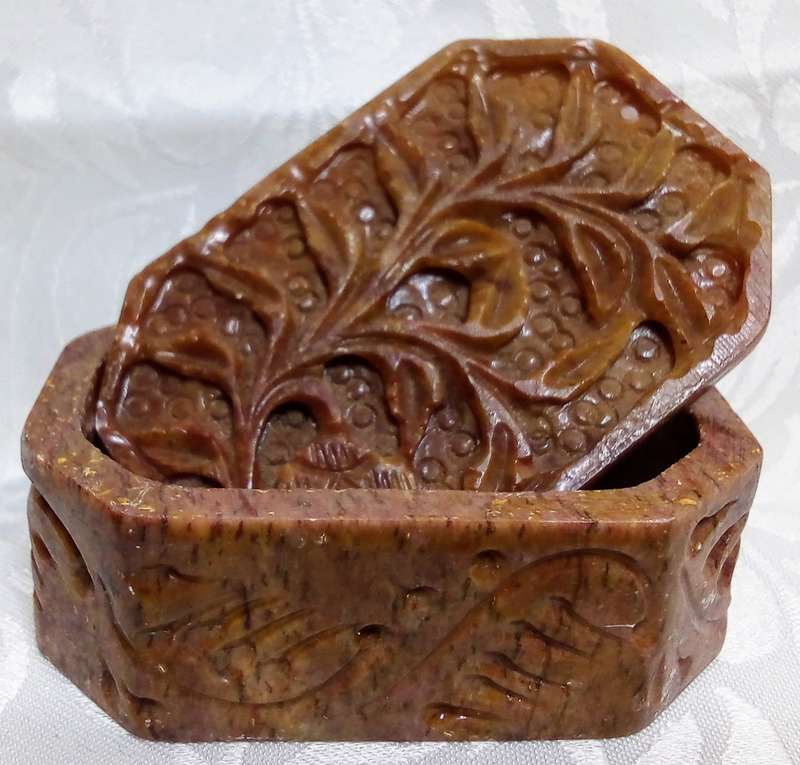 A lovely collection of vintage brown hand carved Soapstone trinket boxes