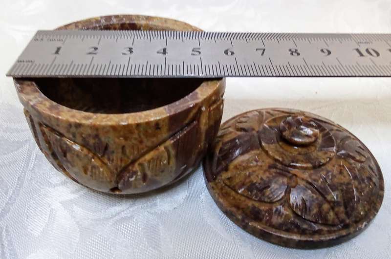 A lovely collection of vintage brown hand carved Soapstone trinket boxes