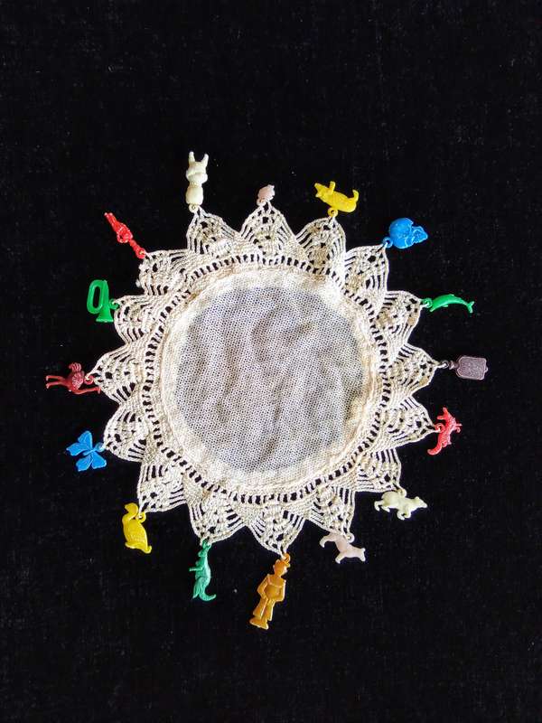 Stunning vintage doily with luckypacket charms!