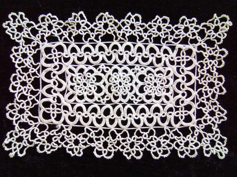 Exquisite white tatted doily