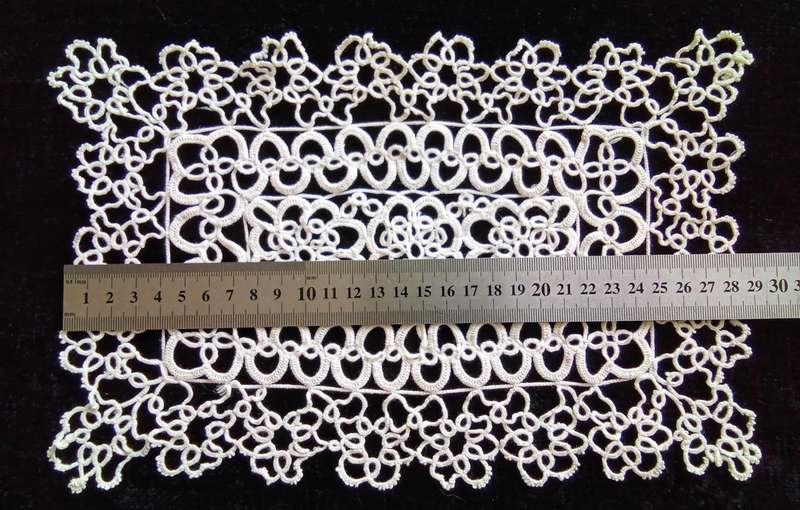 Exquisite white tatted doily