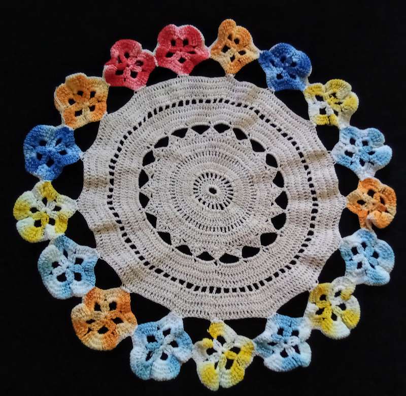 Cute vintage beige hand crocheted doily with flower detail