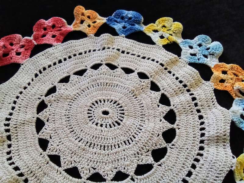 Cute vintage beige hand crocheted doily with flower detail