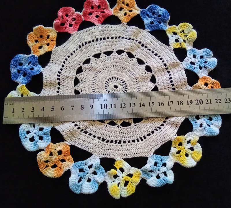 Cute vintage beige hand crocheted doily with flower detail