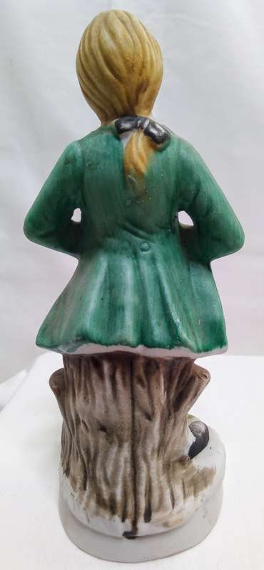 Boy playing accordian porcelain figurine