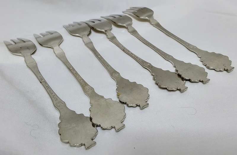 Six lovely cake forks