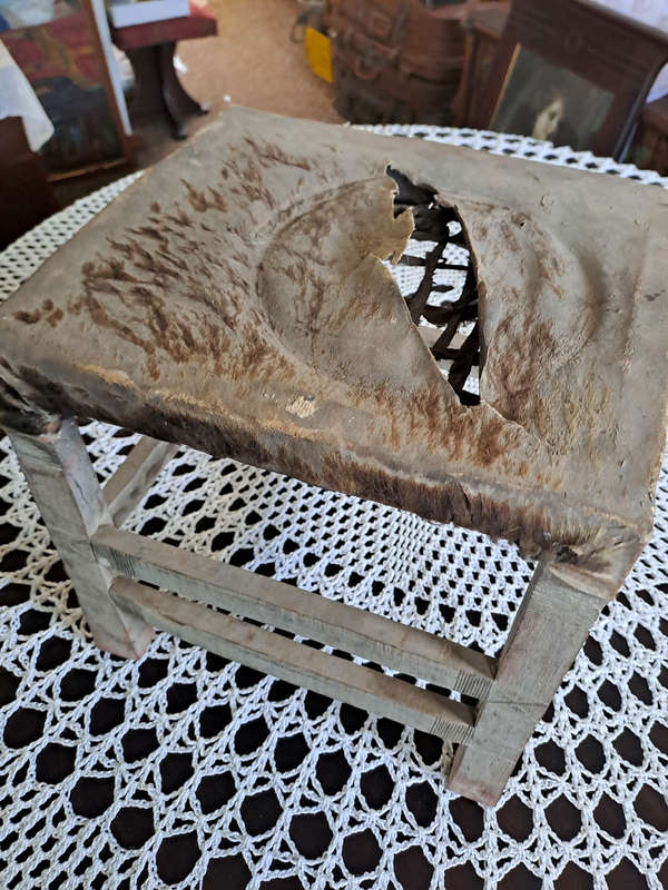 Genuine antique African hide and rimpie small stool
