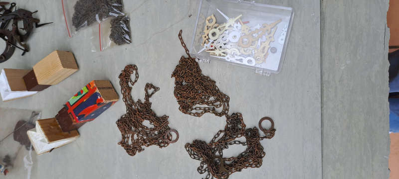 large lot of Cuckoo clock parts, chains, bellows, hands, etc