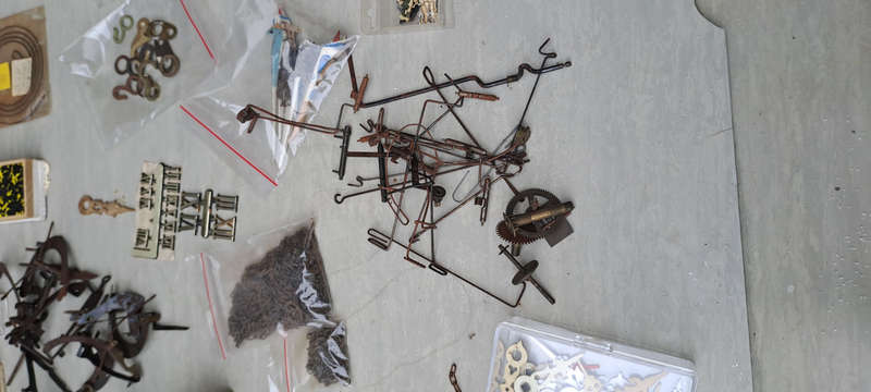 large lot of Cuckoo clock parts, chains, bellows, hands, etc