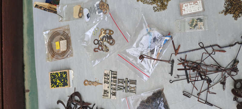 large lot of Cuckoo clock parts, chains, bellows, hands, etc