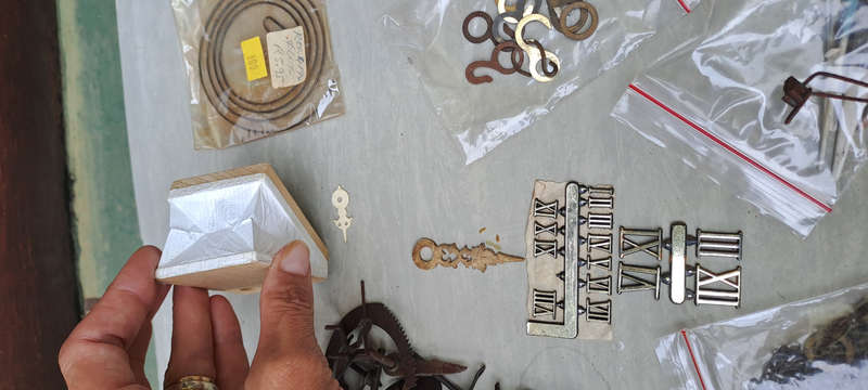 large lot of Cuckoo clock parts, chains, bellows, hands, etc