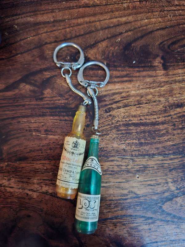 2 vintage bottle keyrings